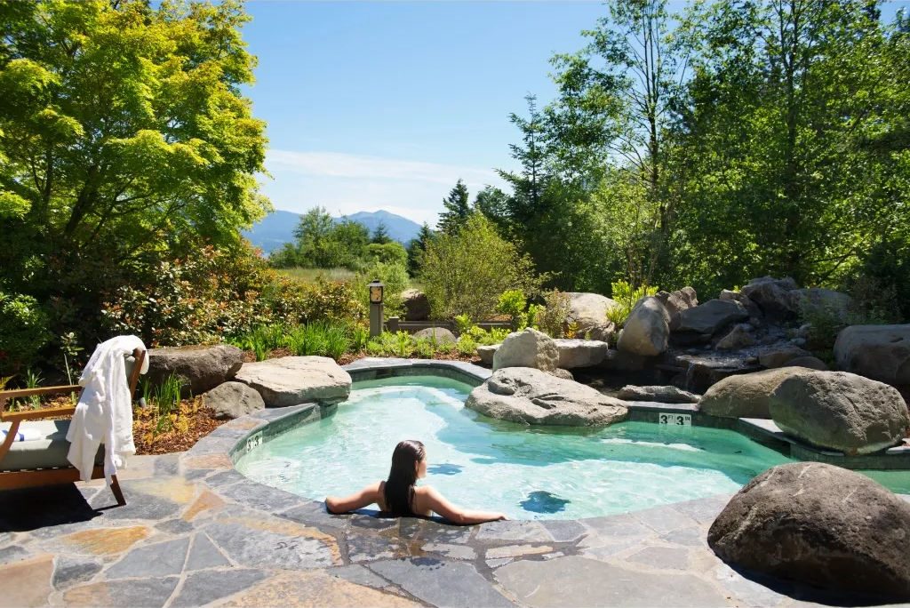 image Unwind at the Skamania Lodge outdoor spa, surrounded by nature's beauty.