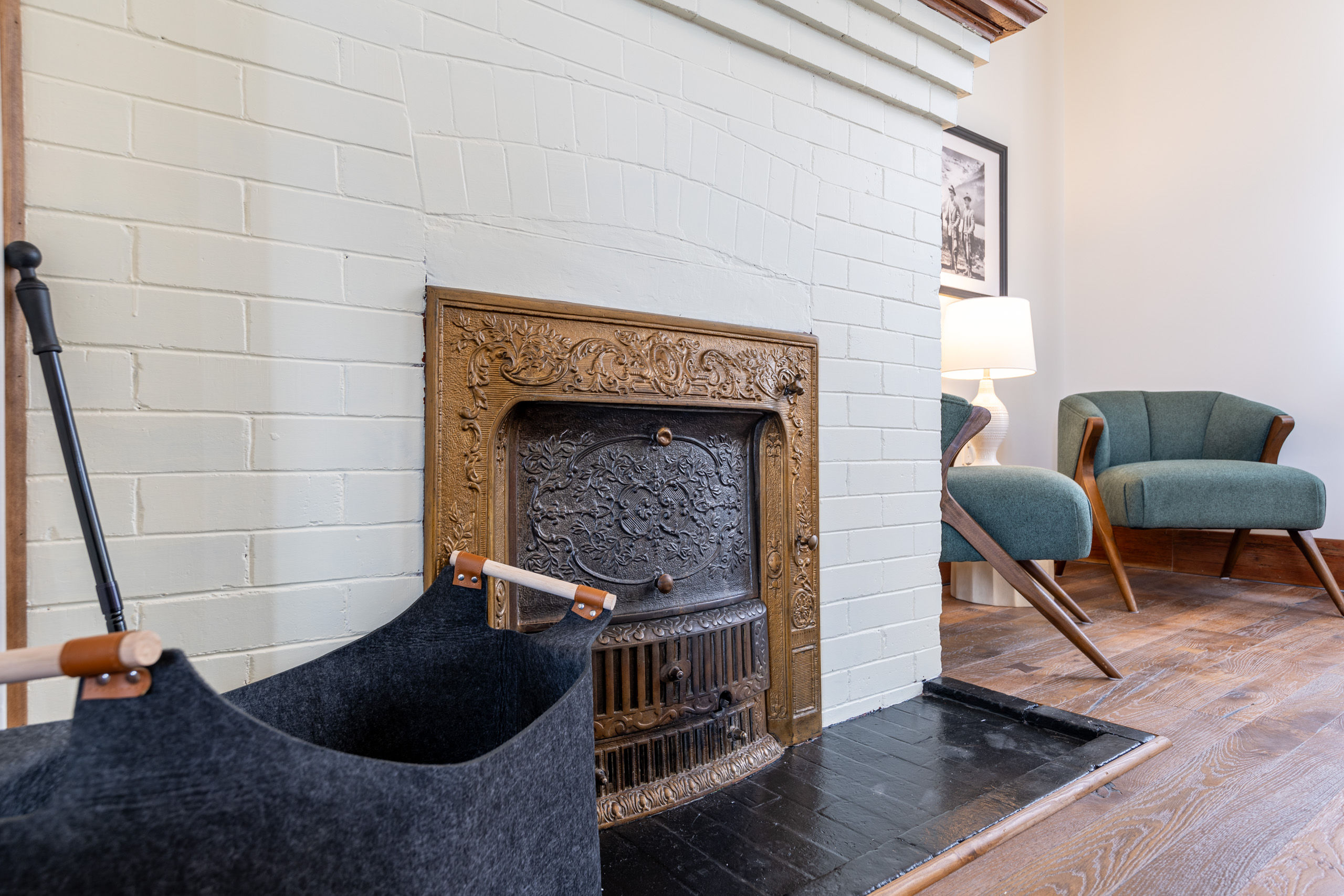 image Admire the intricately designed fireplace, adding a touch of vintage charm to your stay.