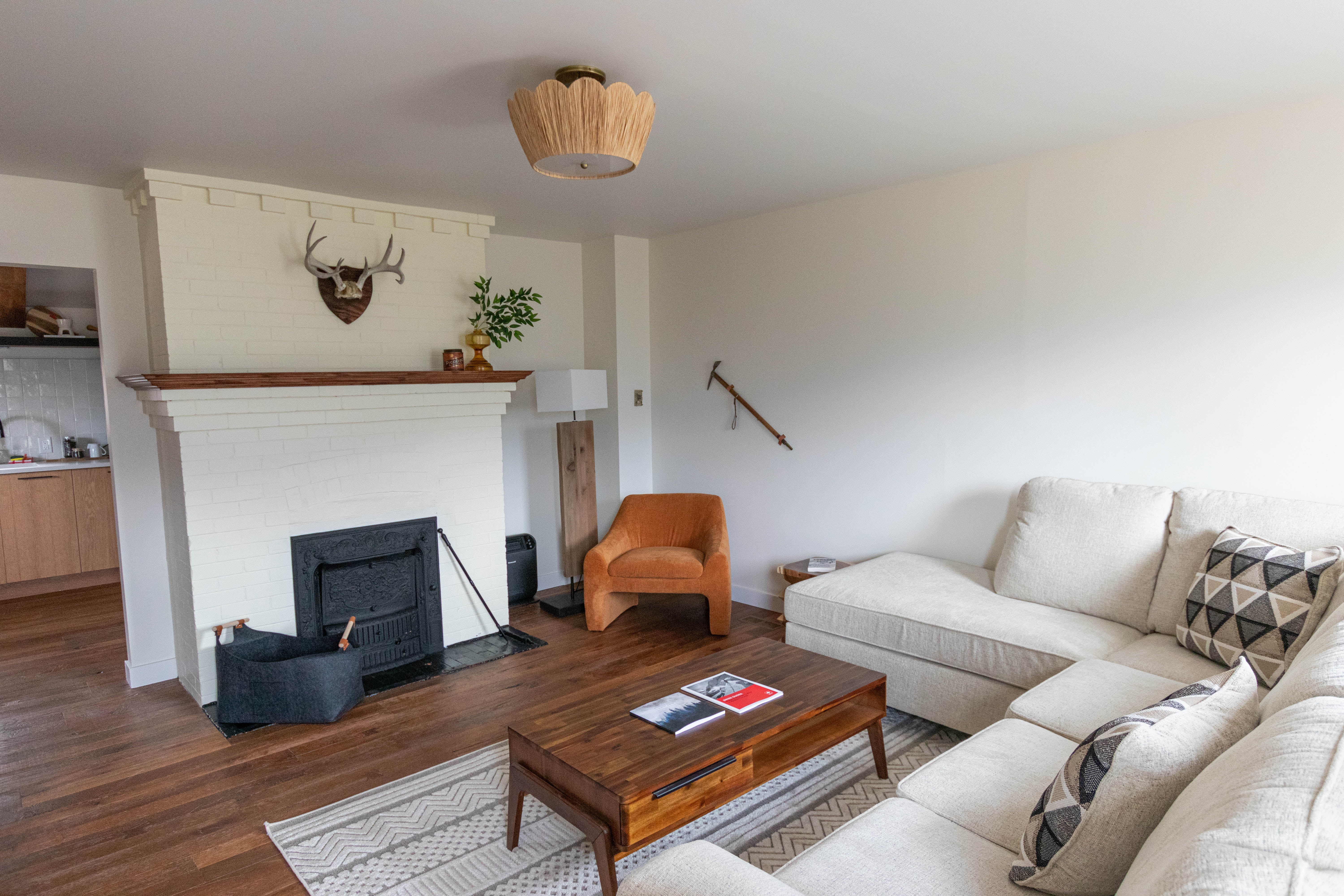 image Relax in the cozy living room featuring an inviting sofa, perfect for unwinding after a day of adventure.