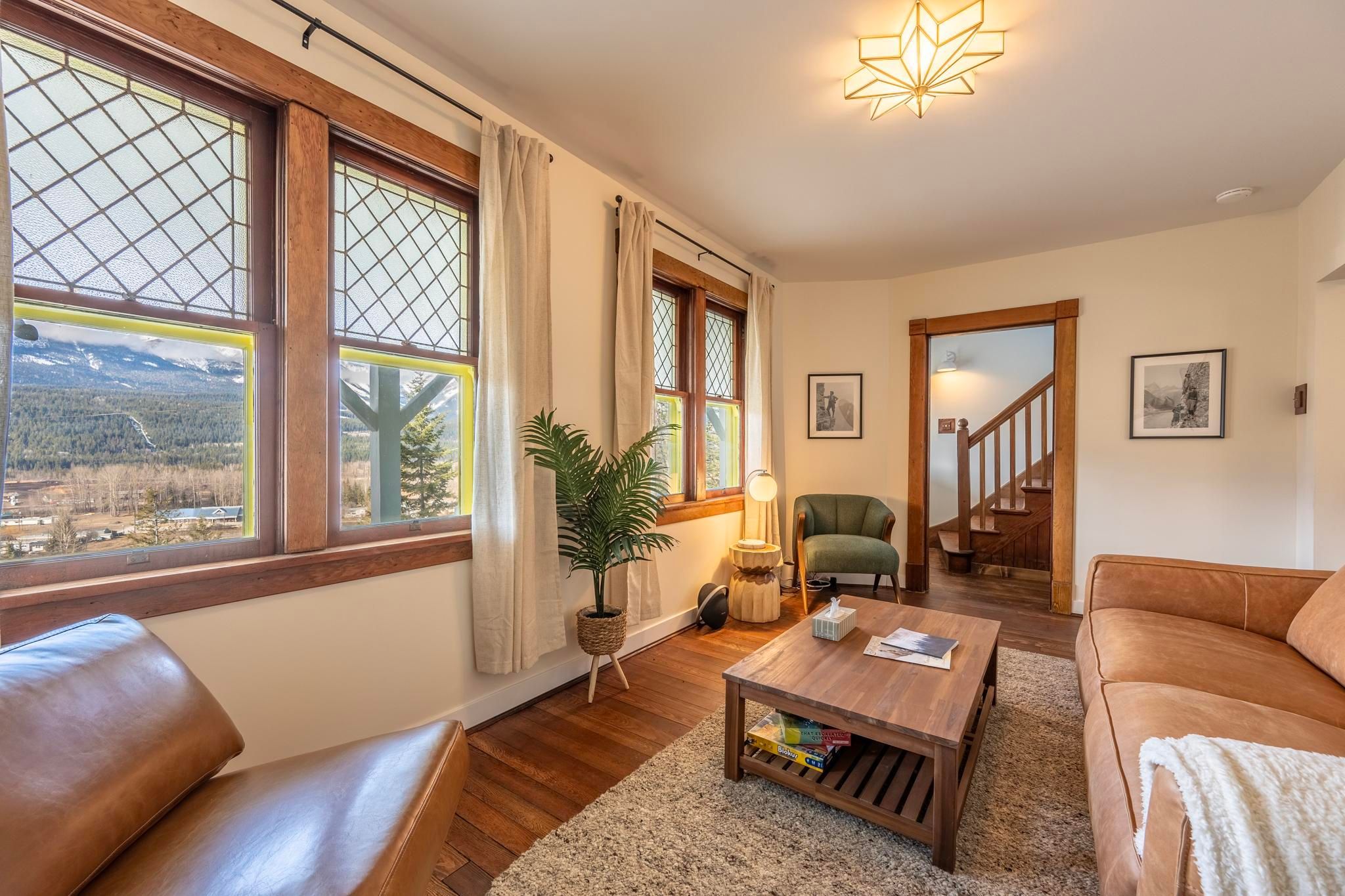 image Enjoy the warmth of natural light filtering through charming windows in a relaxed living space.