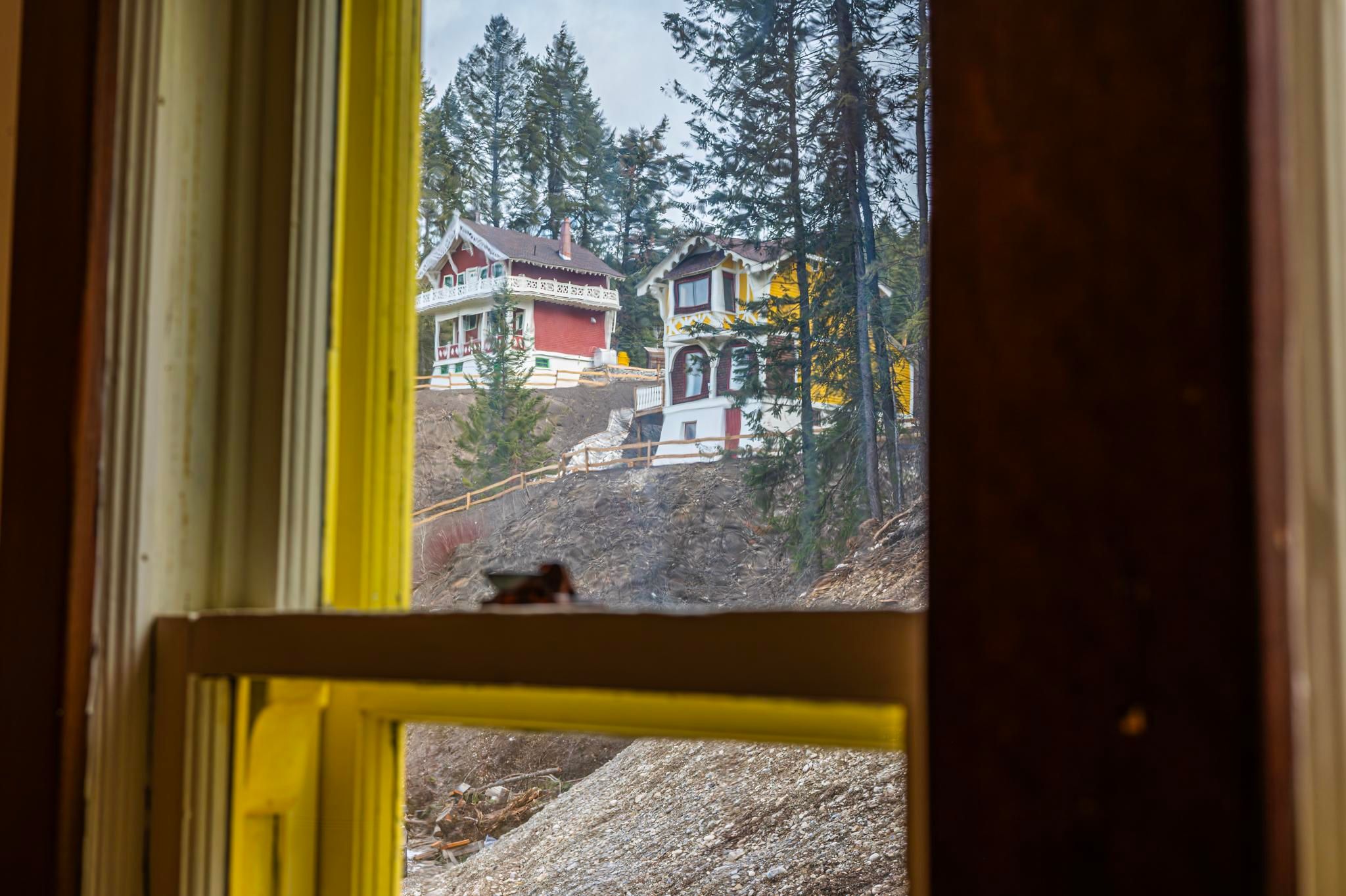 image Catch a glimpse of charming chalets nestled among the trees, radiating alpine charm.