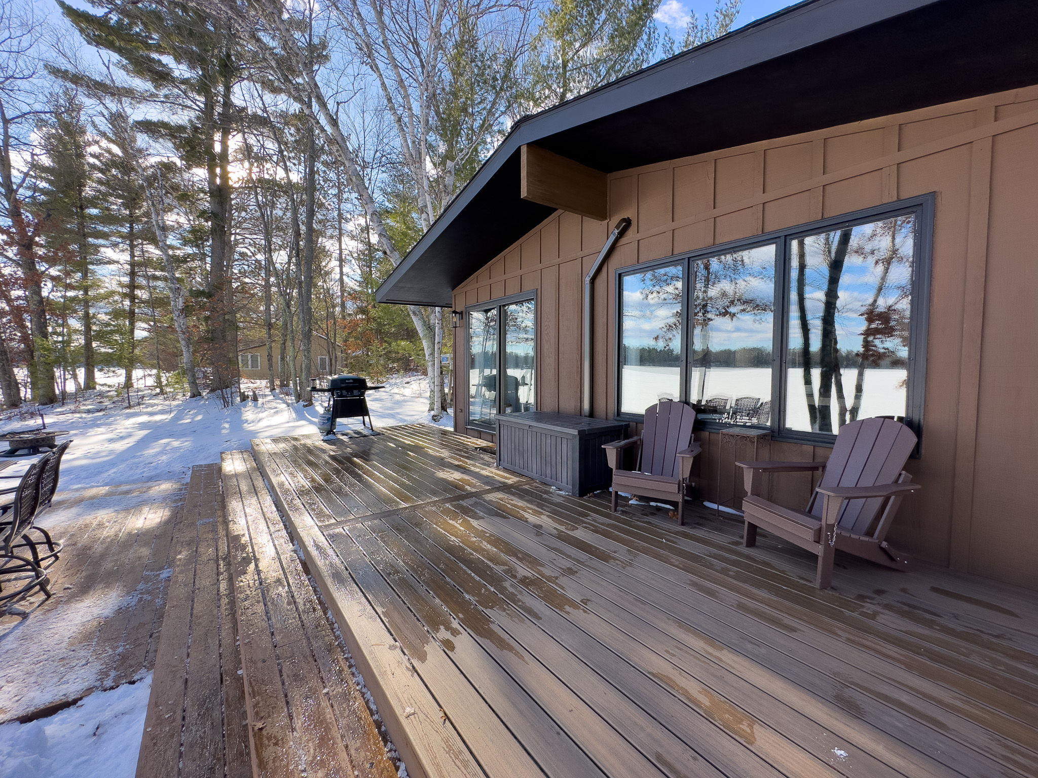 image Spacious deck with stunning lake views, perfect for morning coffee or evening relaxation. Fire up the BBQ and enjoy outdoor dining in any season!