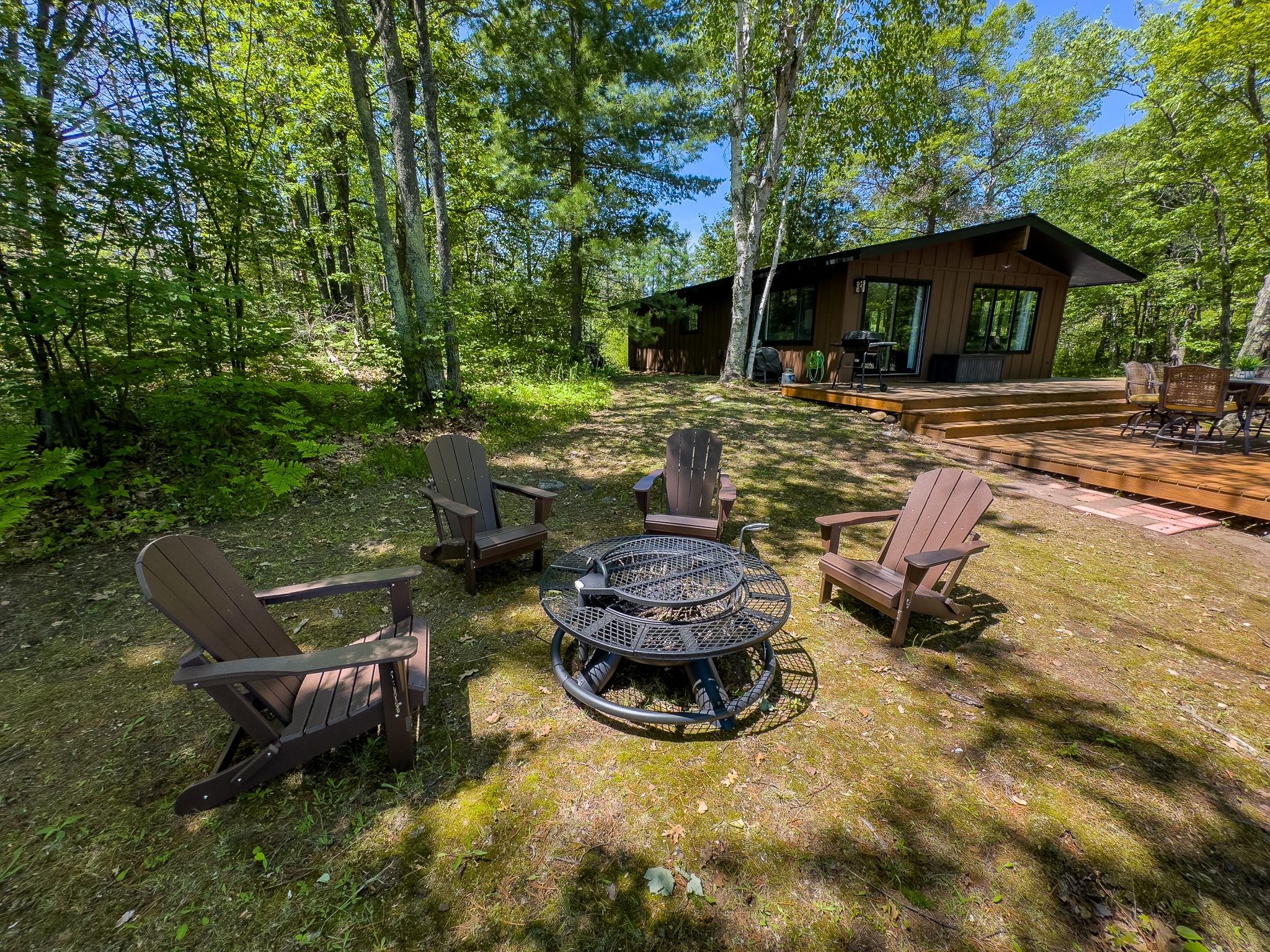 image Gather around the cozy fire pit for evening s’mores, stories, and starry skies just steps from the deck and surrounded by nature.