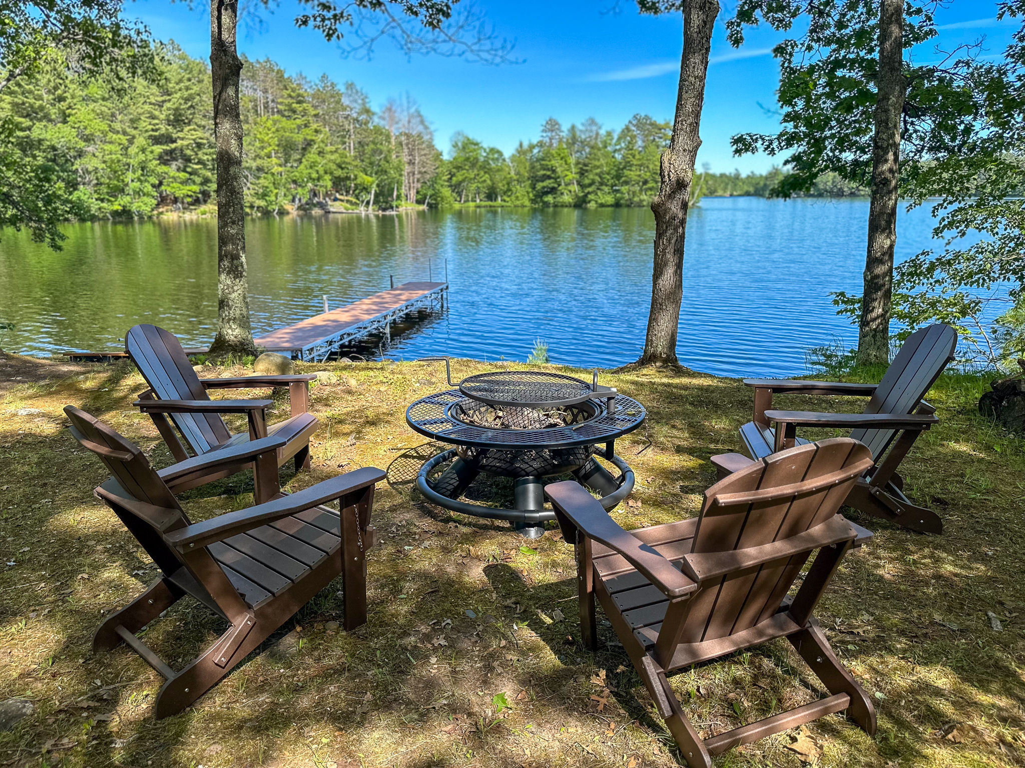 image Enjoy serene evenings by Twin Bear Lake with a cozy fire pit, perfect for making s'mores and sharing stories under the stars.