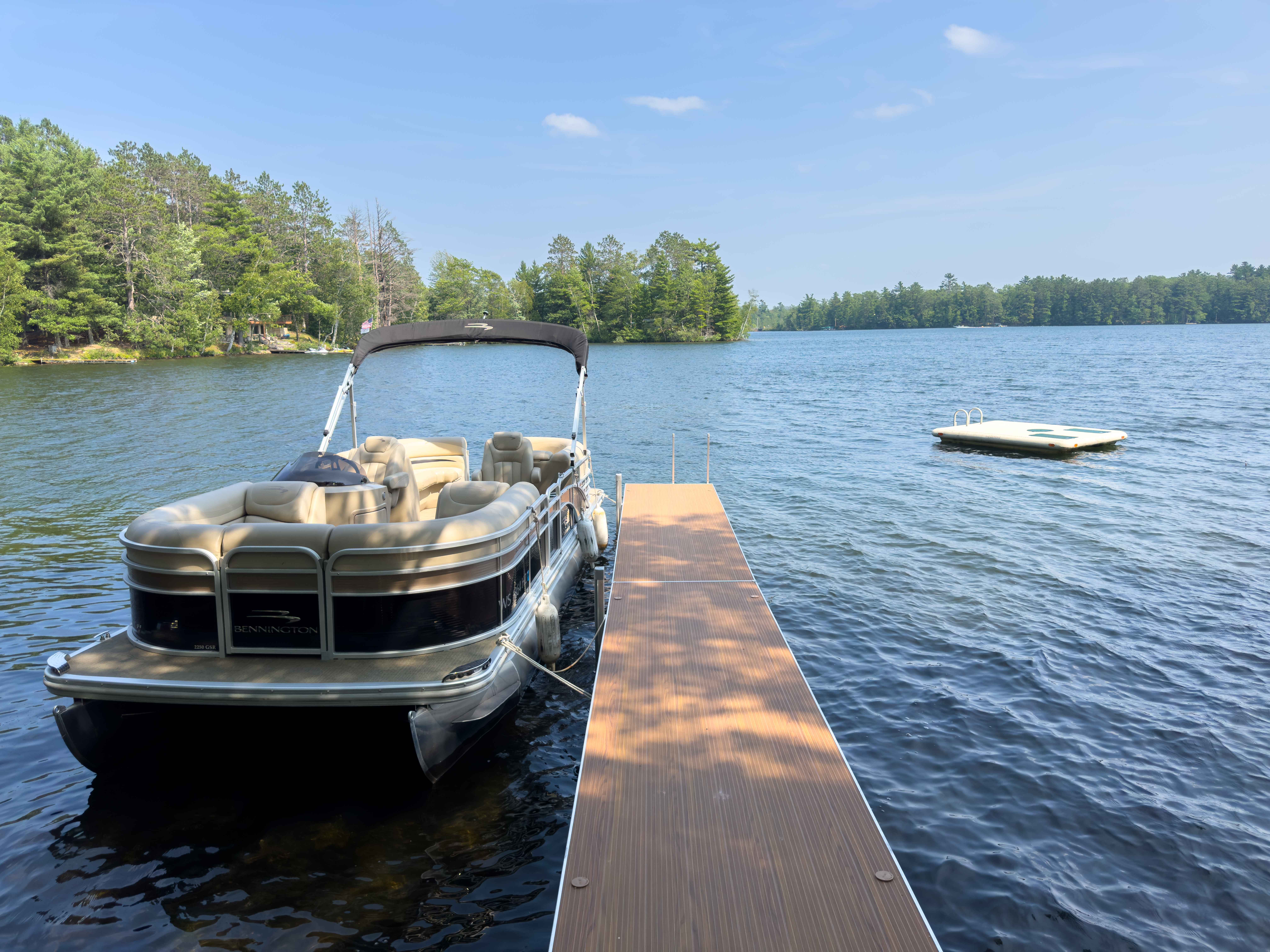 image Enjoy direct lake access with a private pontoon, perfect for launching your adventures on the water. Includes 2 kayaks, a paddle boat, and a swim raft for endless lake fun!