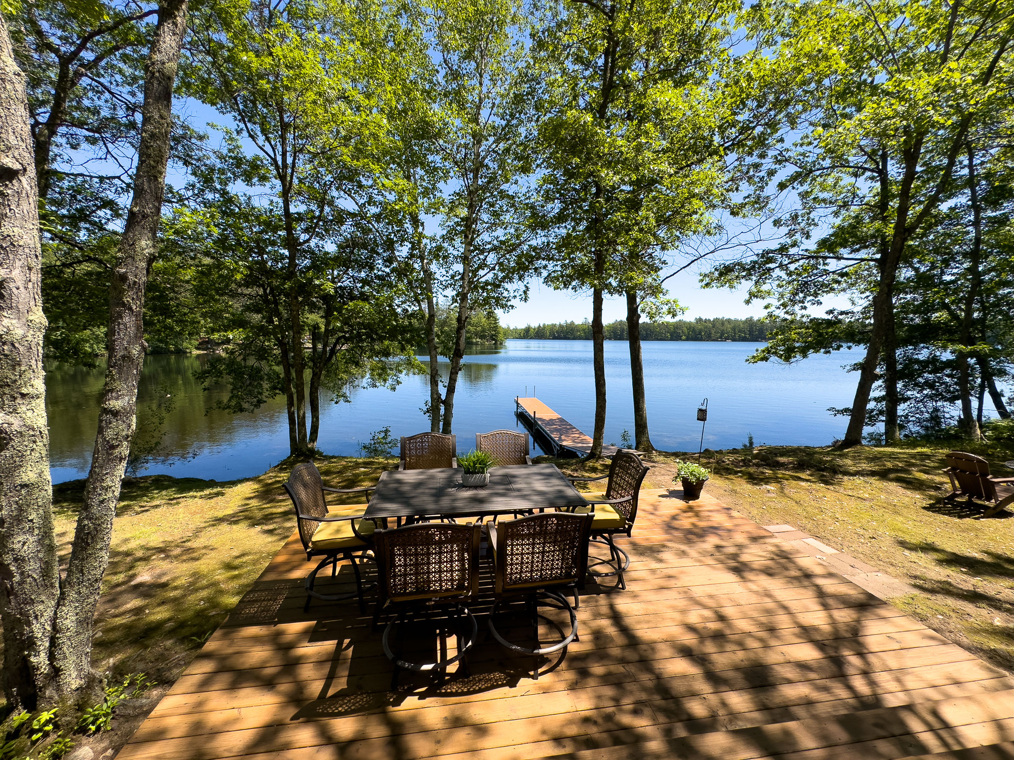 image Dine outdoors with stunning views of Twin Bear Lake—this spacious patio is perfect for morning coffee or evening BBQs under the trees.