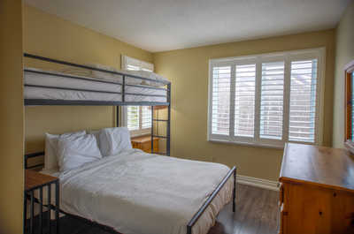 Another bedroom with bunk beds, offering ample sleeping space for guests.