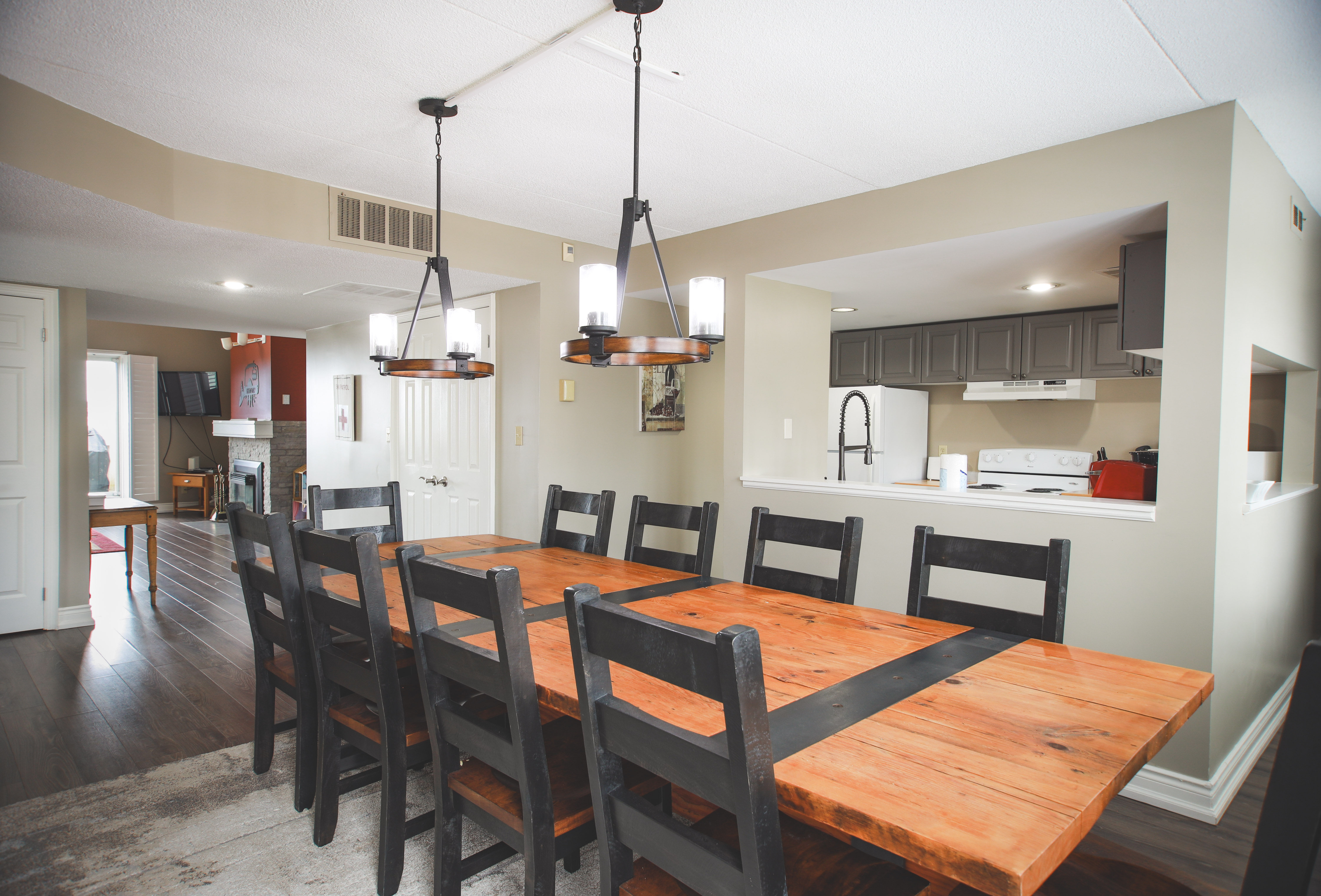 image Host family dinners in the elegant dining area with a large table and stylish lighting.