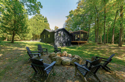 Firepit area with Muskoka chairs, perfect for evening gatherings under the stars