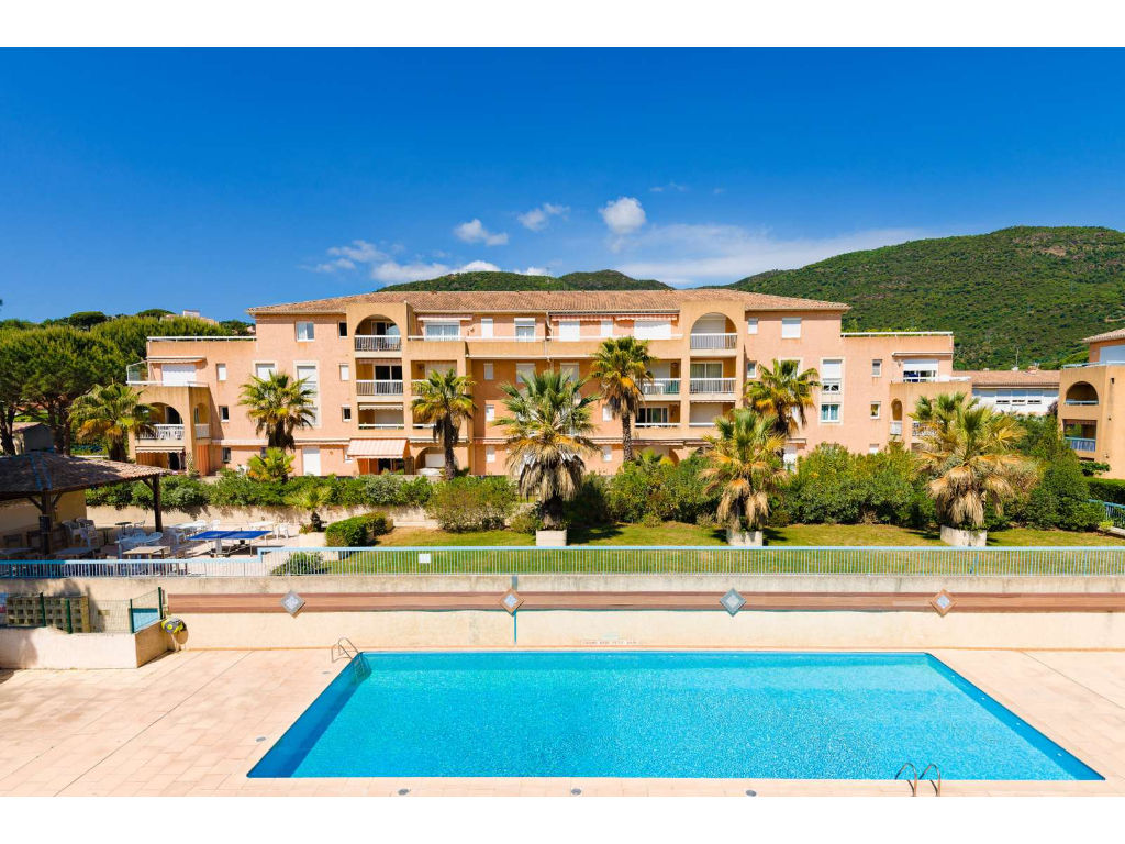 image Relax by the outdoor swimming pool, surrounded by nature and the beautiful mountain backdrop. Open from early May to mid-October, the pool is perfect for a refreshing dip between 9 a.m. and 9 p.m.