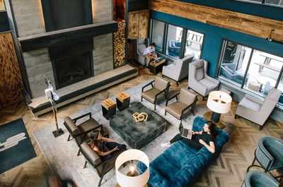 Spacious and stylish lounge with plush seating and a welcoming atmosphere, ideal for relaxation or casual conversations.