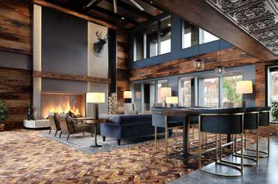 Warm and inviting space with rich wood accents and a cozy fireplace, perfect for unwinding after a long day.