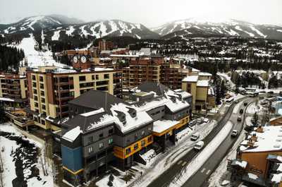 Picturesque alpine village surrounded by breathtaking snow-capped mountains, offering the perfect winter escape.