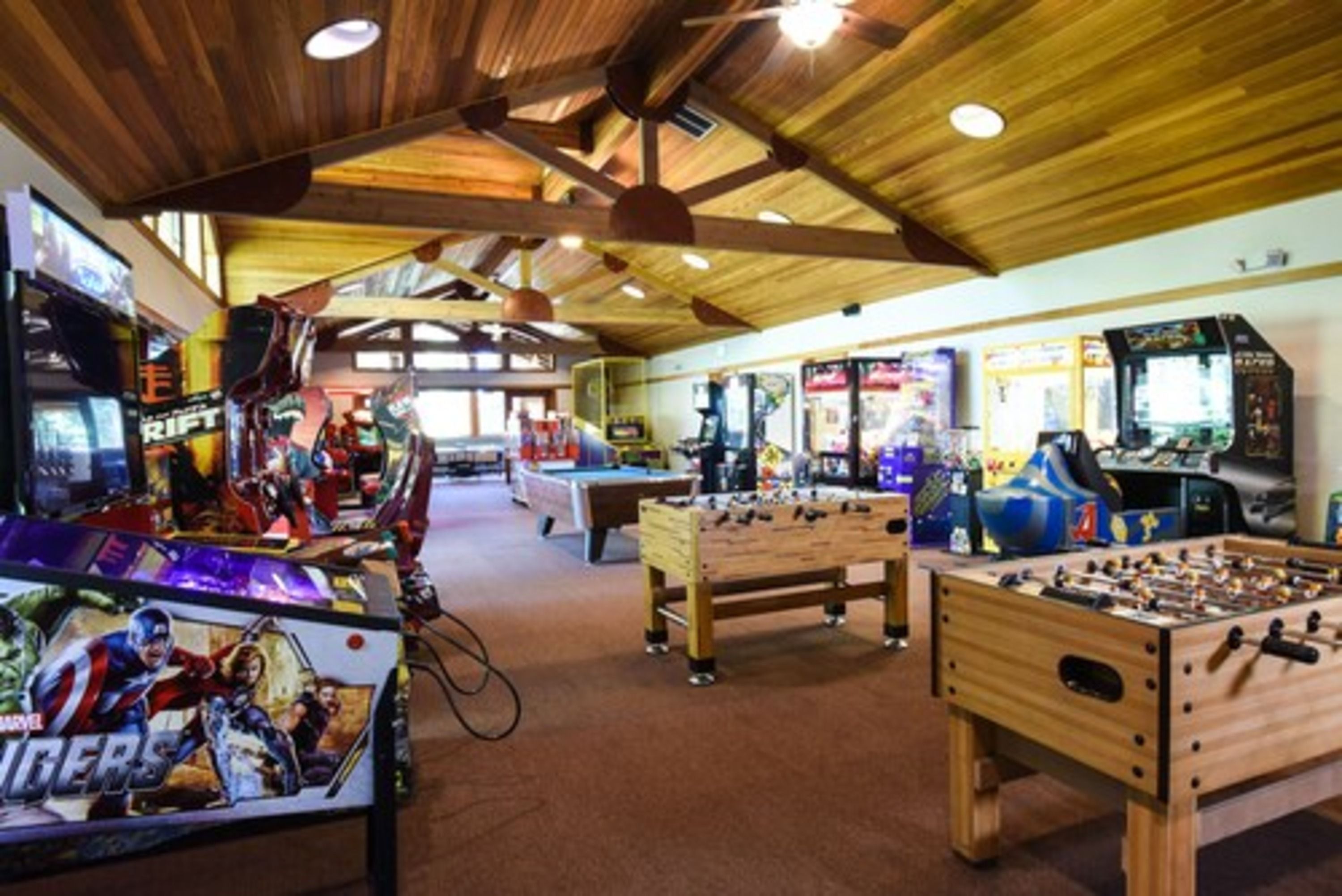 image Kids and adults alike will love the vibrant game room, offering endless entertainment for all ages.