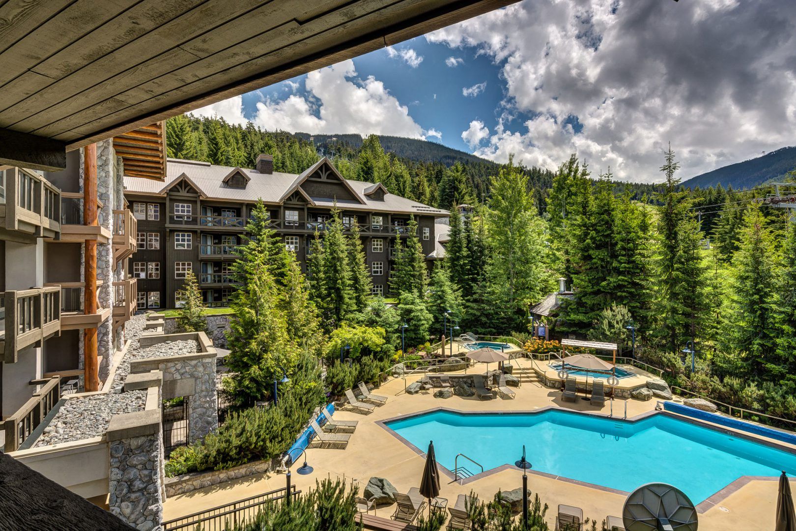 image Outdoor pool surrounded by lush greenery—summer relaxation at its best.
