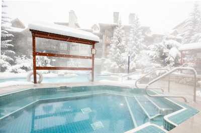 Soak in the hot tub with mountain views, perfect post-ski relaxation.