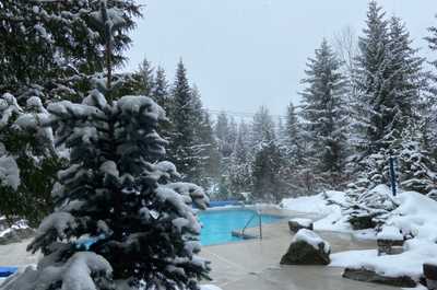 Snowy escape with poolside comfort after a day on the slopes.