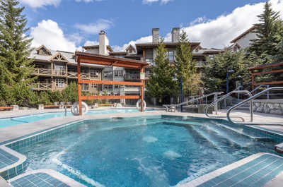 Spacious outdoor pool and hot tub, perfect for a summer escape.