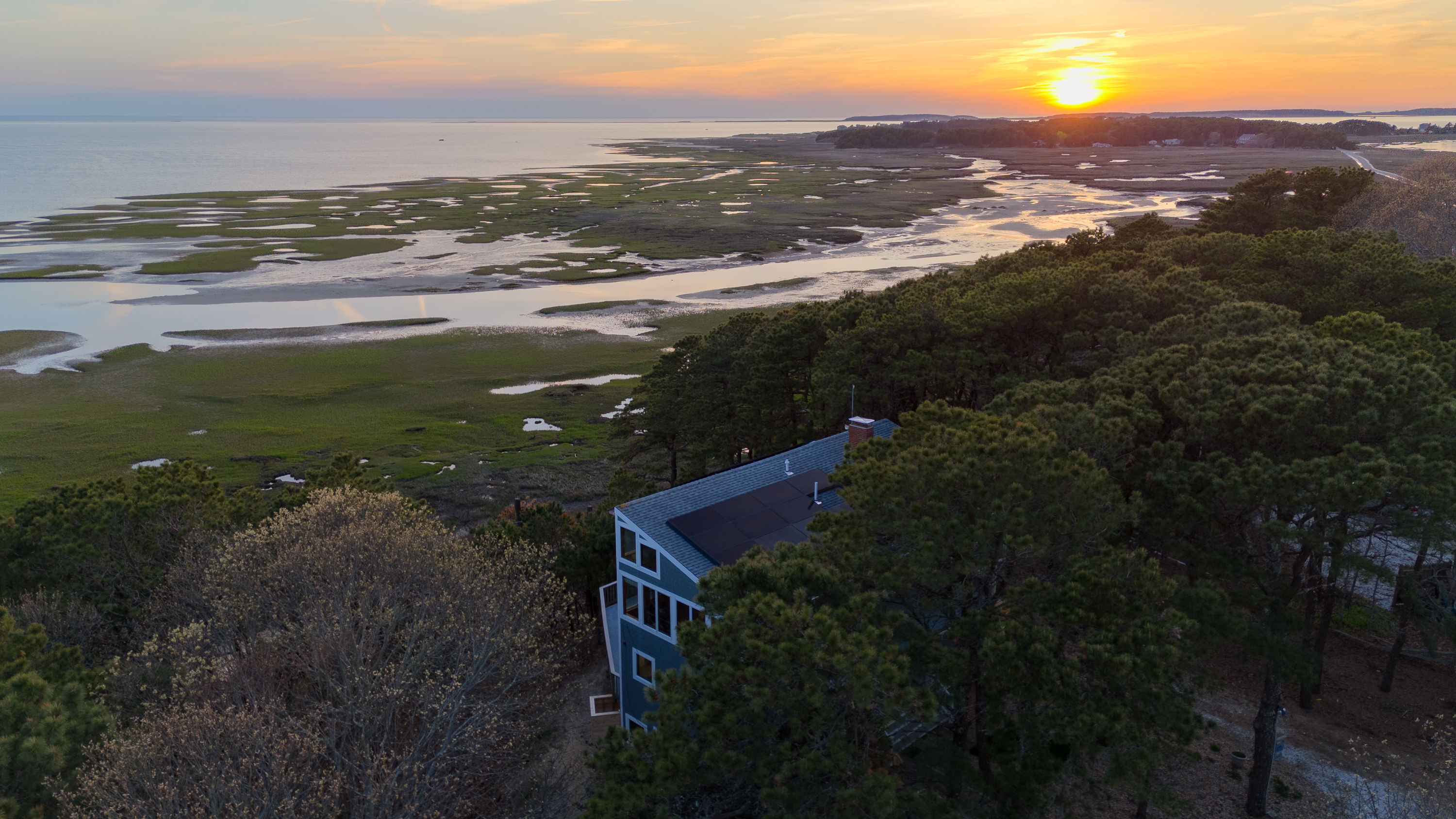 image Watch the sunset over the scenic marshlands, a perfect way to end the day from the comfort of your home.