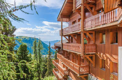 Nestled in the mountains, this charming retreat offers breathtaking forest views from private balconies, immersing you in serene nature.