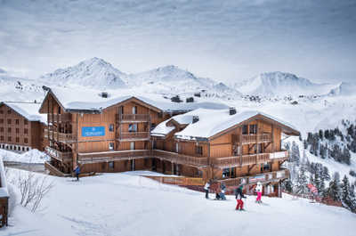 This alpine retreat offers direct access to the slopes and breathtaking views of snow-capped mountains.