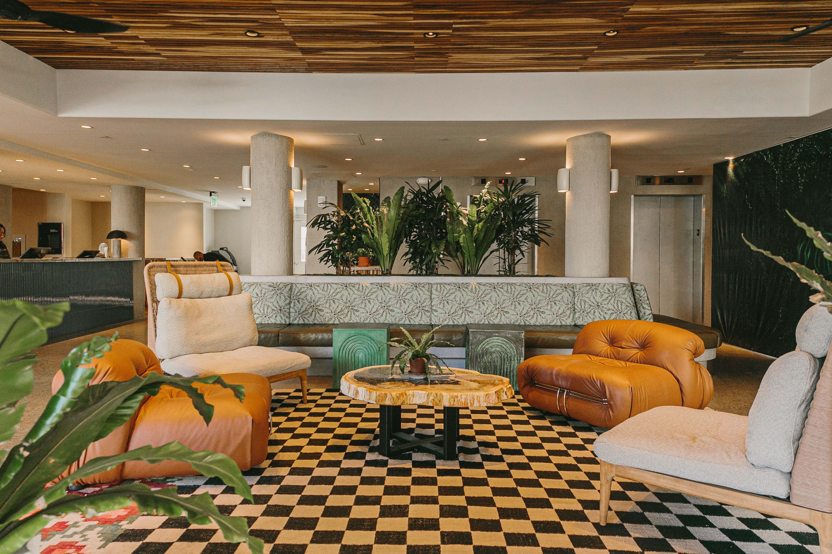 image This spacious and vibrant lobby, with its bold patterns and inviting seating, creates the perfect spot to relax and unwind in a lively atmosphere.