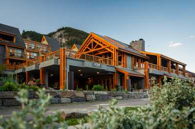 Breathe in mountain air from the outdoor seating area, surrounded by pine forest and peaks on all sides