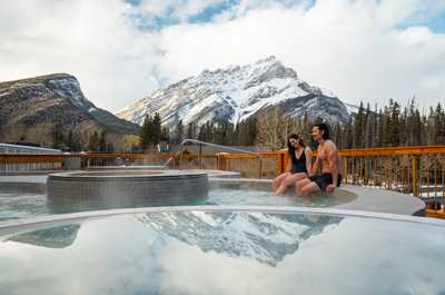 Relax in the hot tub as snow-capped peaks frame the view.