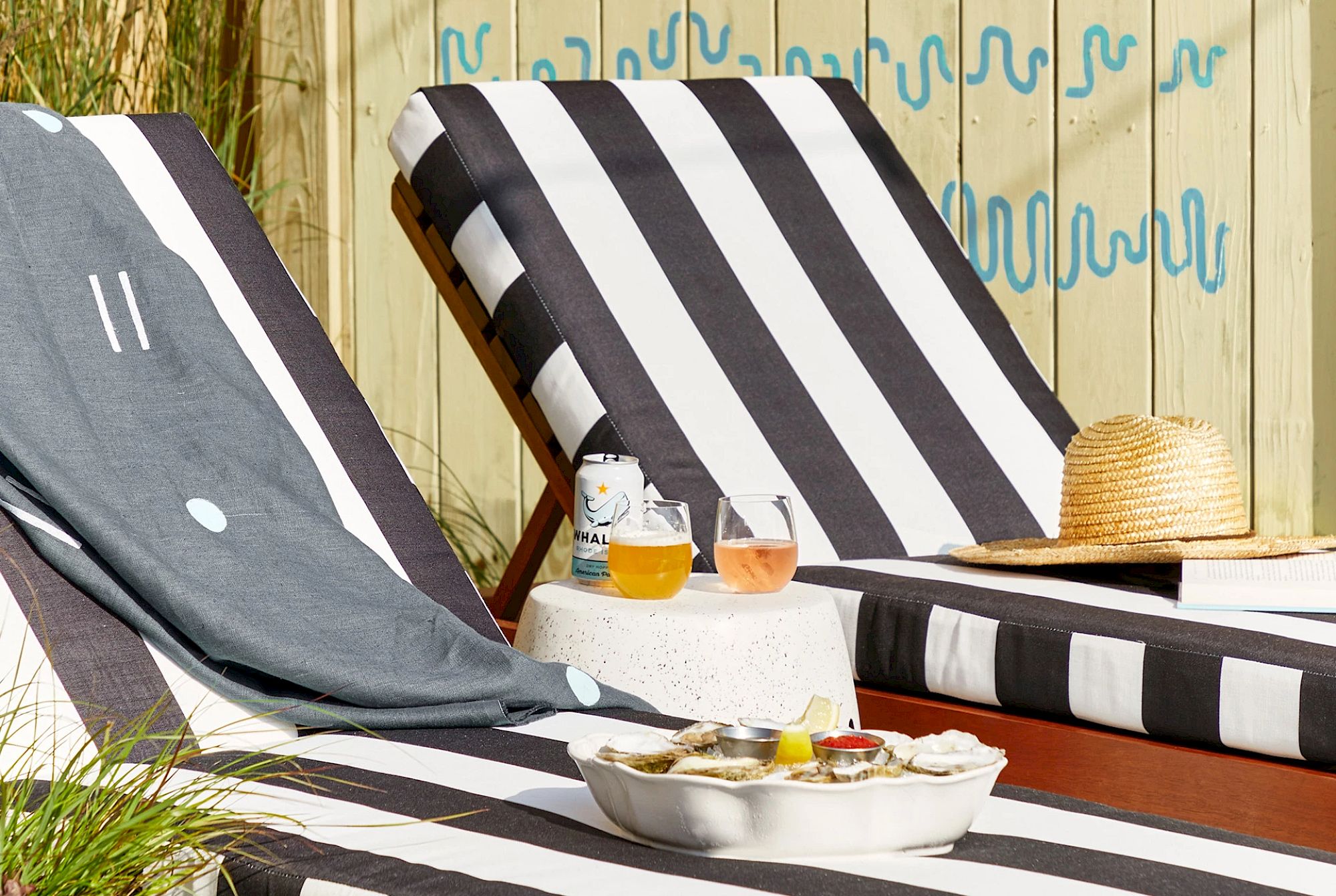 image Soak up the sun in stylish lounge chairs by the pool, better with drink in hand!