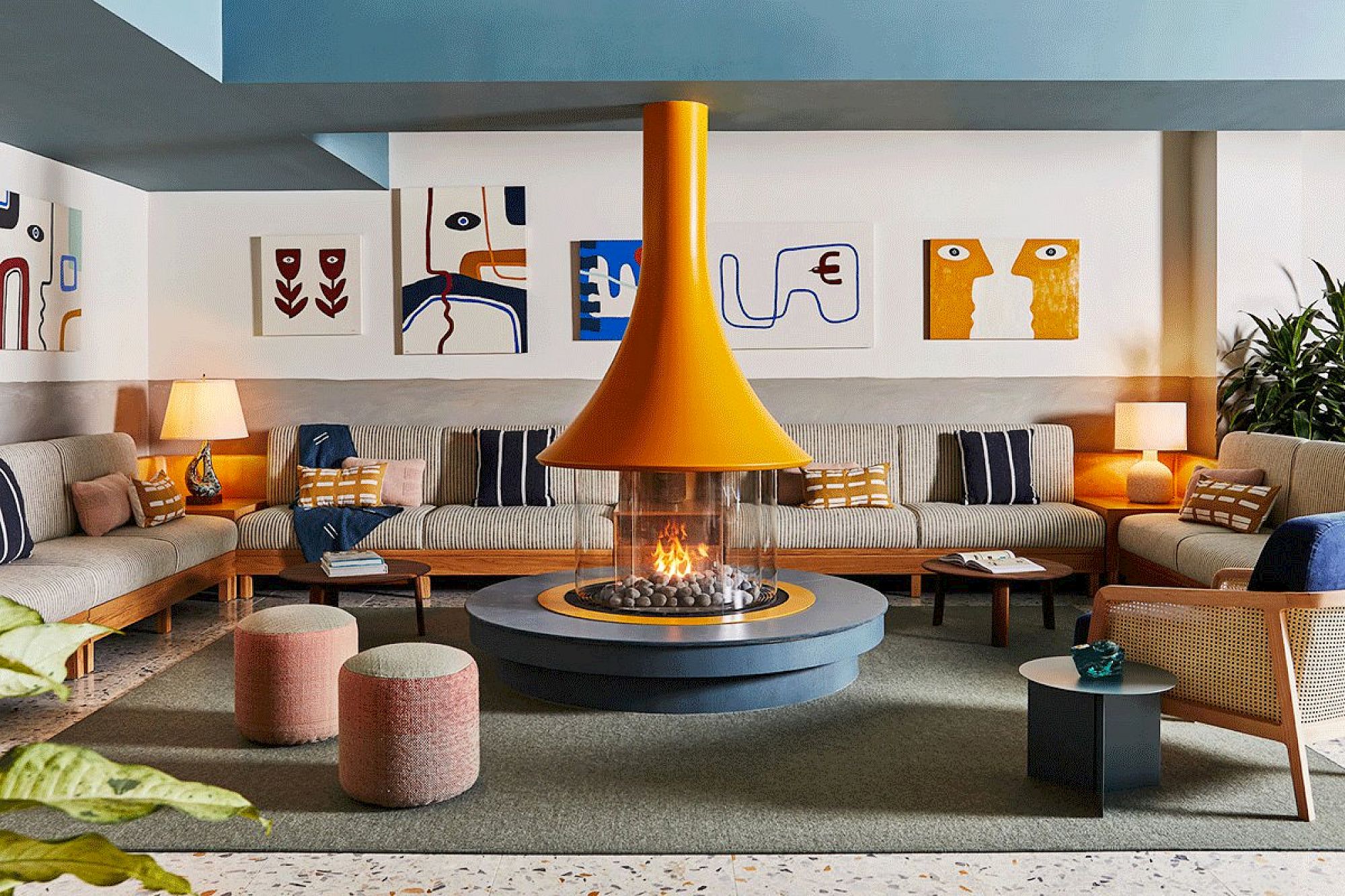 image A collection of local artwork creates the perfect spot for relaxation, as art and comfort blend seamlessly.