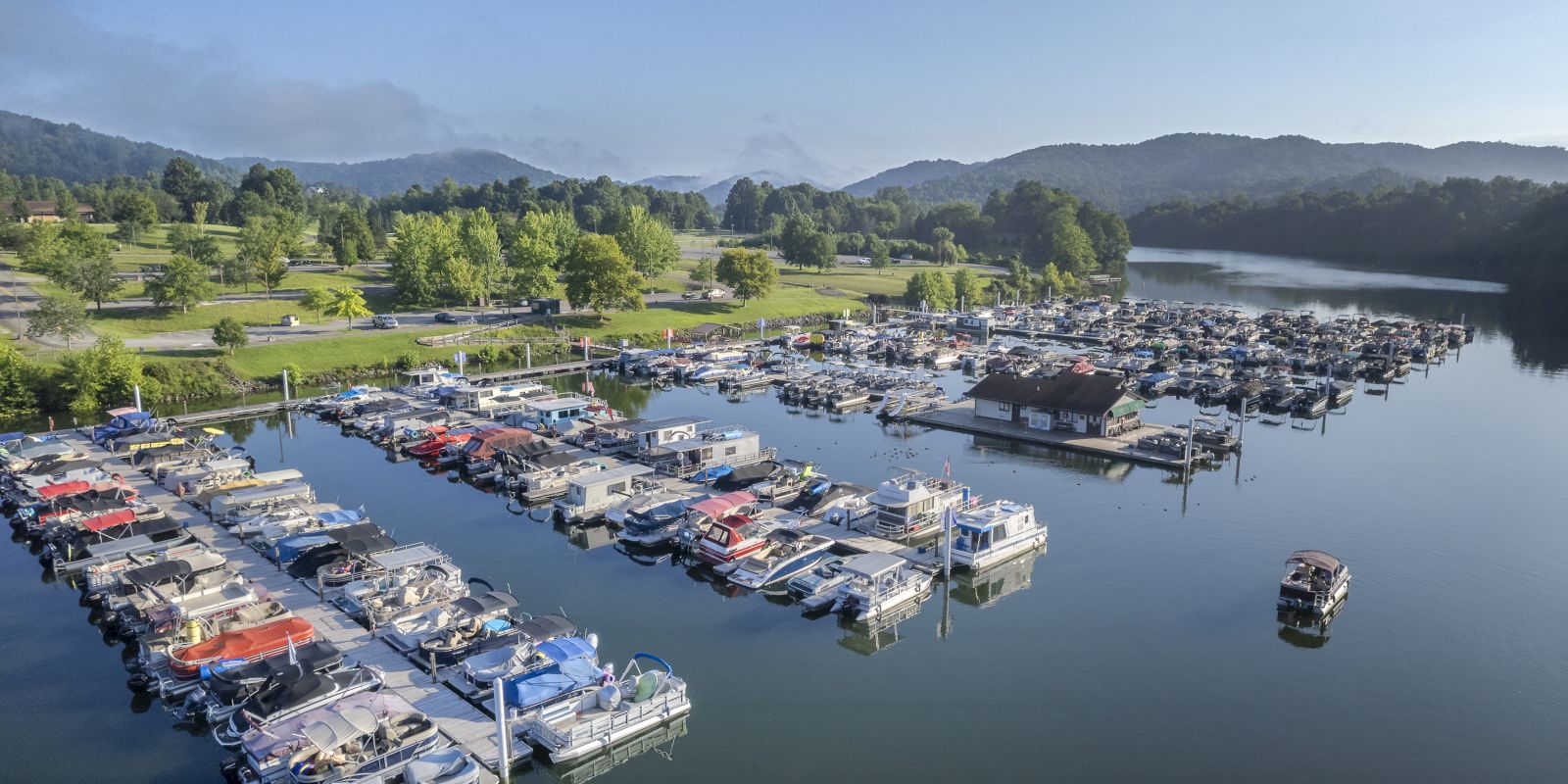 image Colorful boats line the marina, promising easy access to lake adventures and leisurely moments on the water.