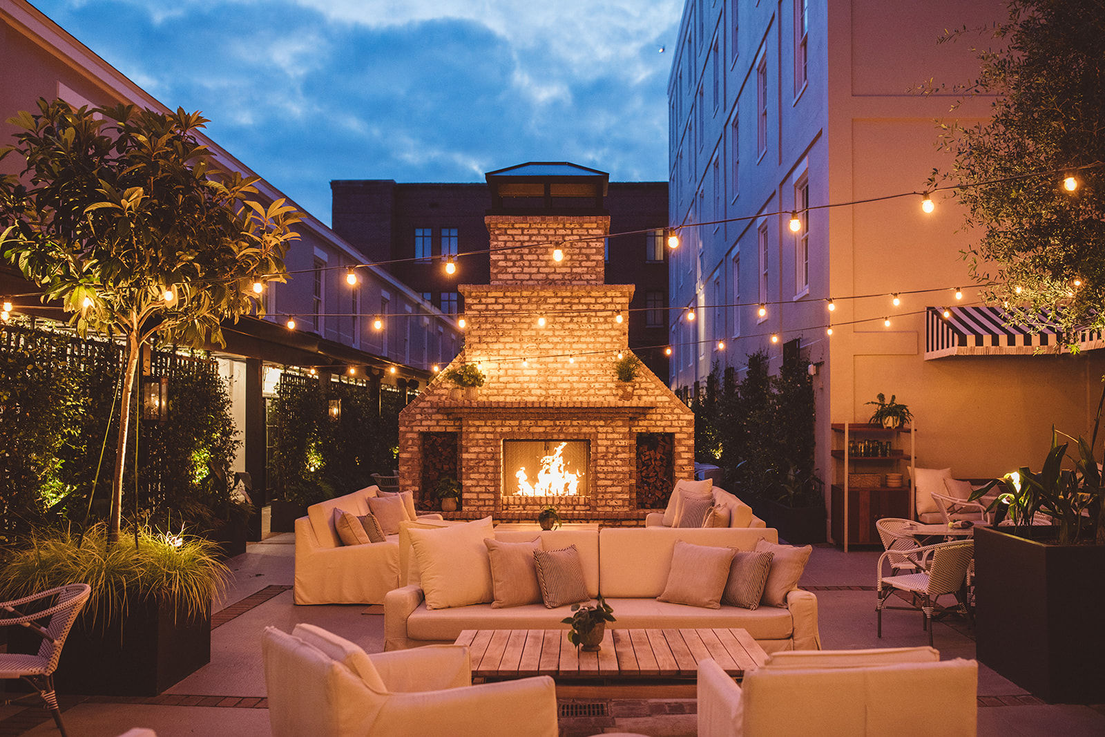 image Evening ambiance at its finest, with the glow of the fireplace and twinkling lights setting the stage for unforgettable moments.
