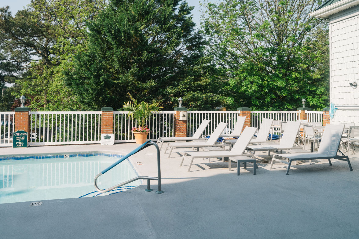 image Refreshing dips and shaded lounging await in this secluded poolside escape, designed for ultimate relaxation.