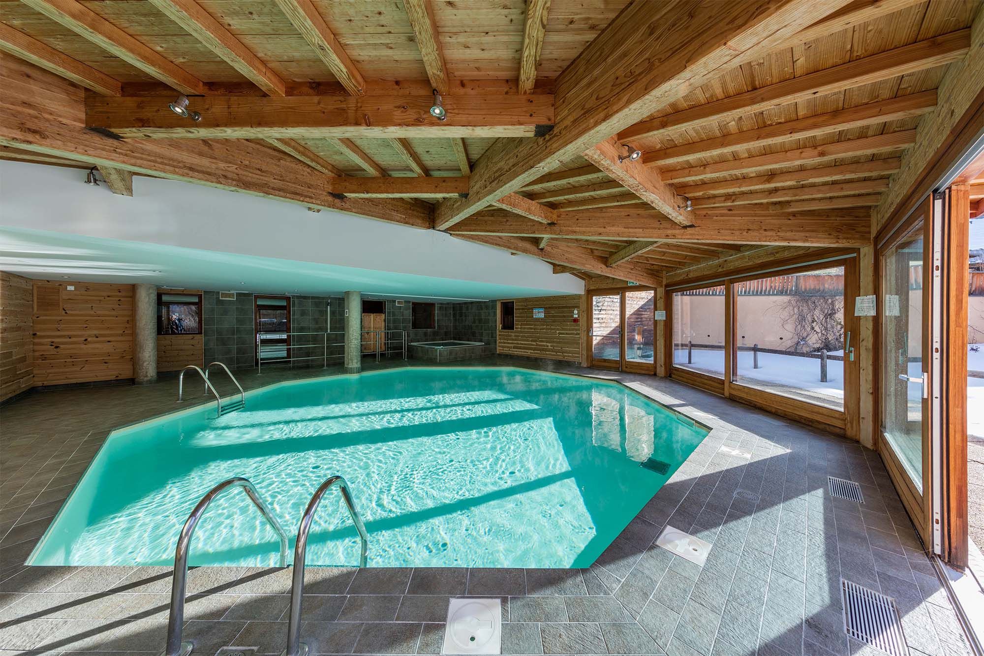 image The indoor heated pool, bathed in natural light, offering a perfect spot to relax after a day on the pistes.