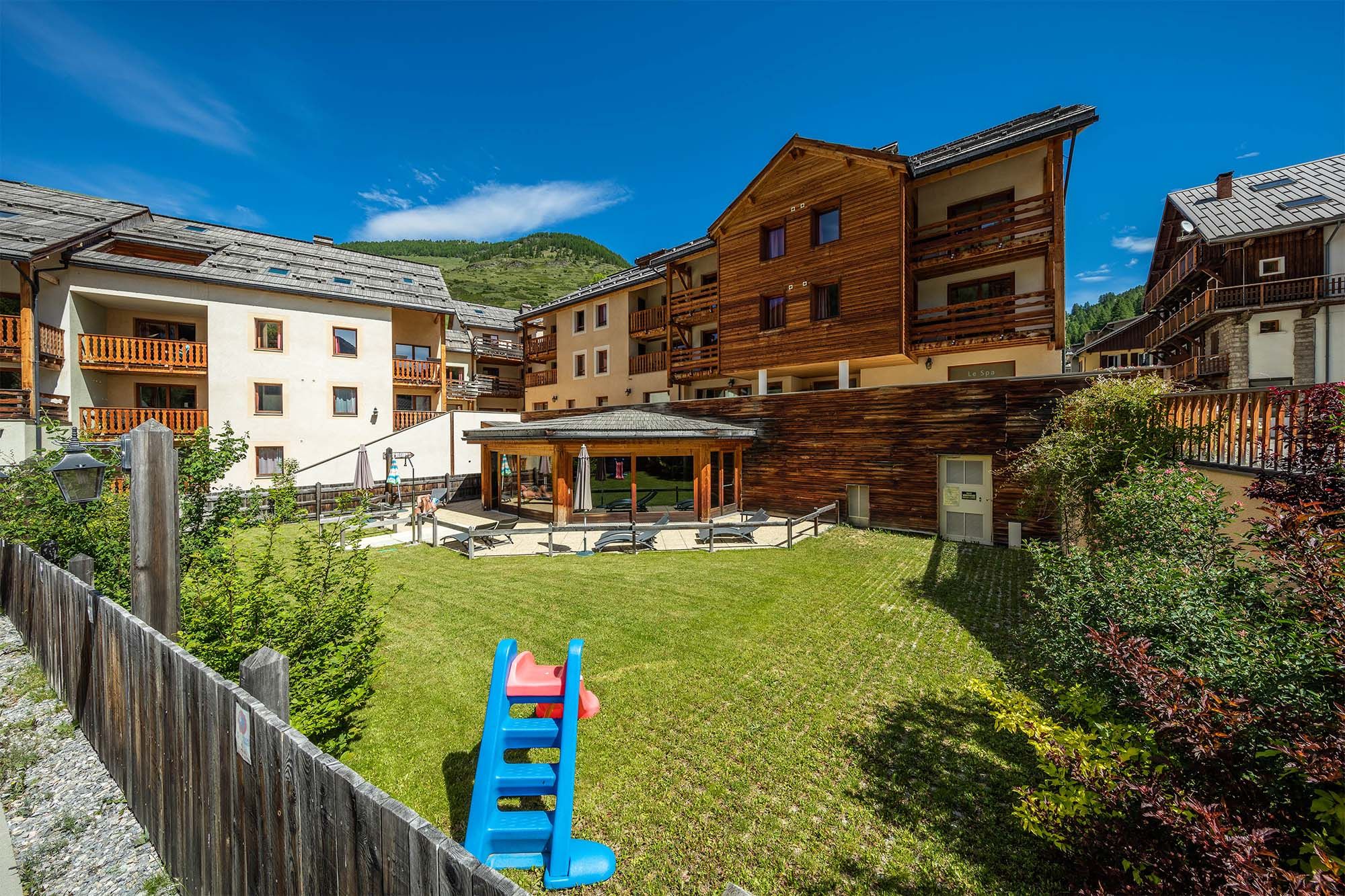 image A family-friendly environment with outdoor play areas, perfect for a summer retreat in the mountains.