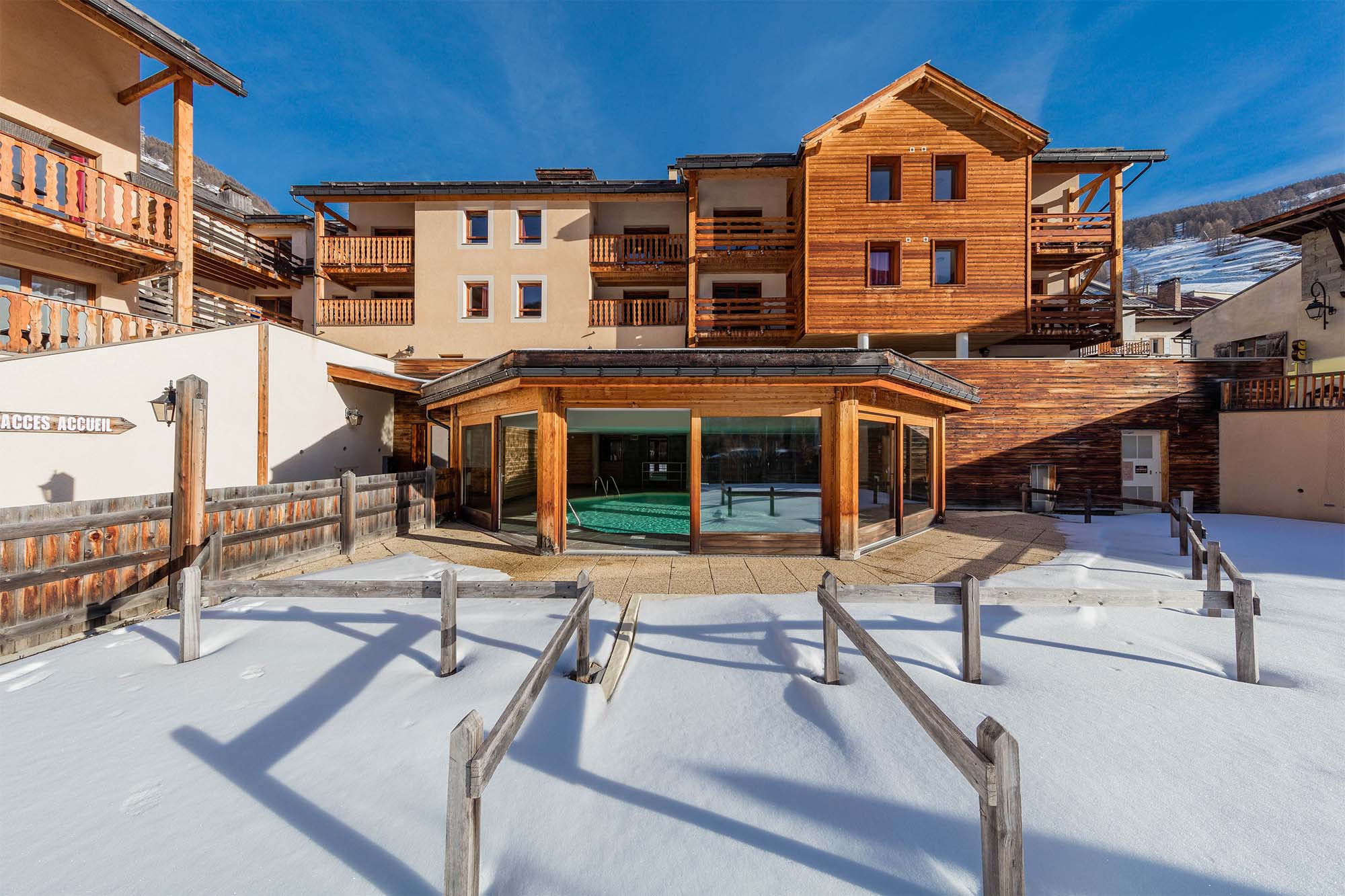 image Another angle showcasing the residence’s mountain architecture and its prime location near the slopes.