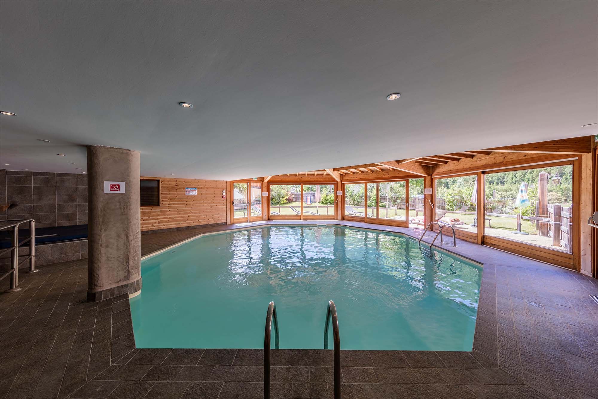 image The inviting indoor heated pool, offering relaxation all year round, even during the warmer months.