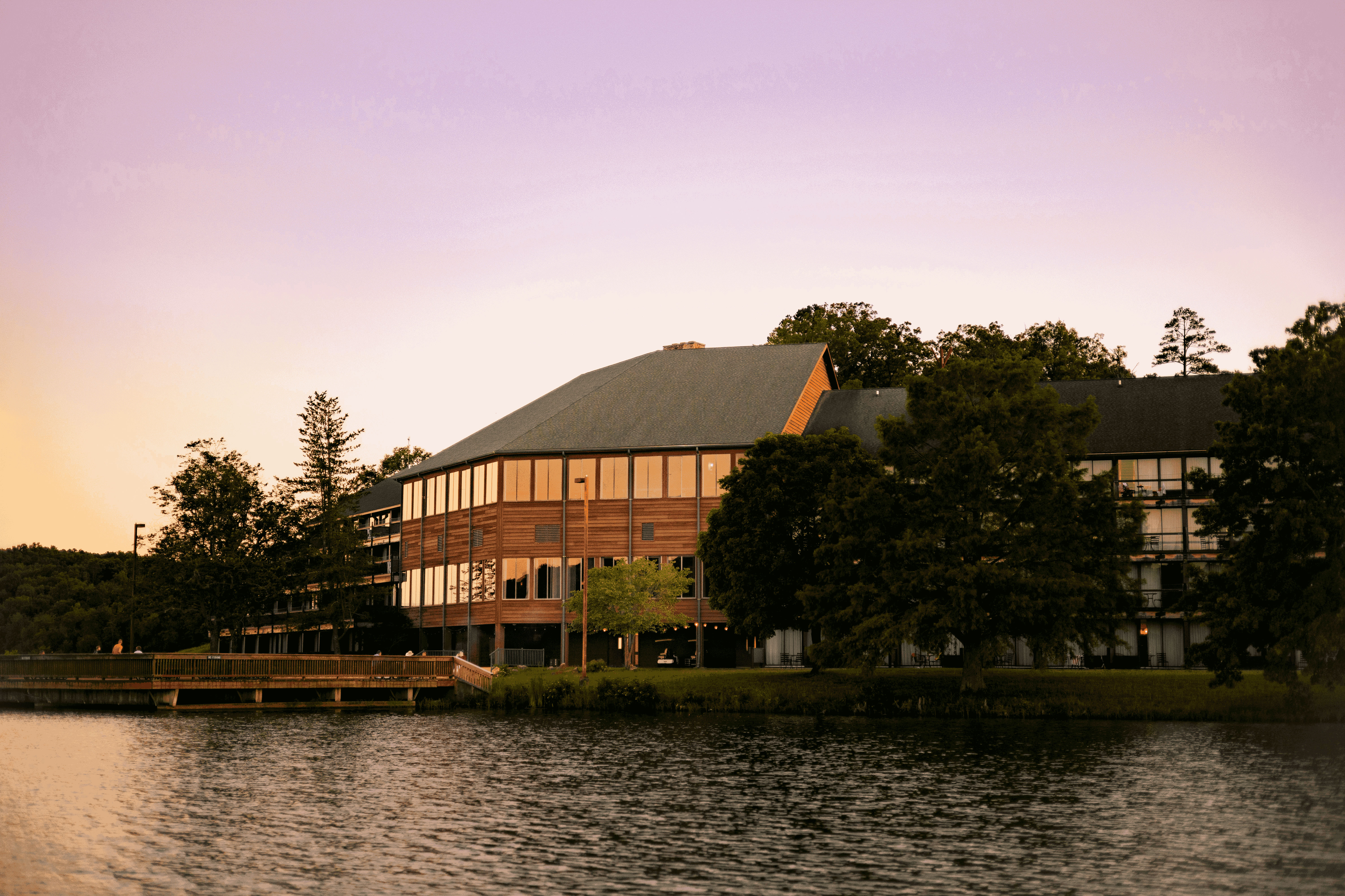 image Watch the sun set over the lake, casting a golden glow on the serene waters.