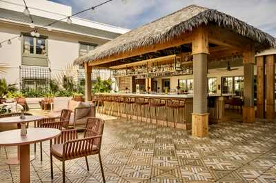 Gather under the thatched roof for easygoing moments, where every seat invites laughter and stories shared.