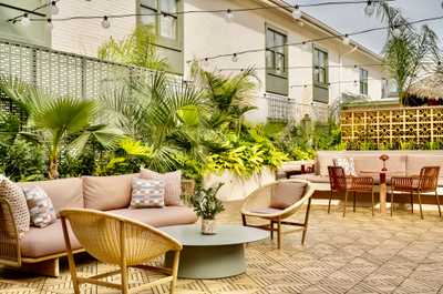 Surrounded by greenery and warm light, this cozy nook sets the scene for slow mornings and sun-drenched afternoons.