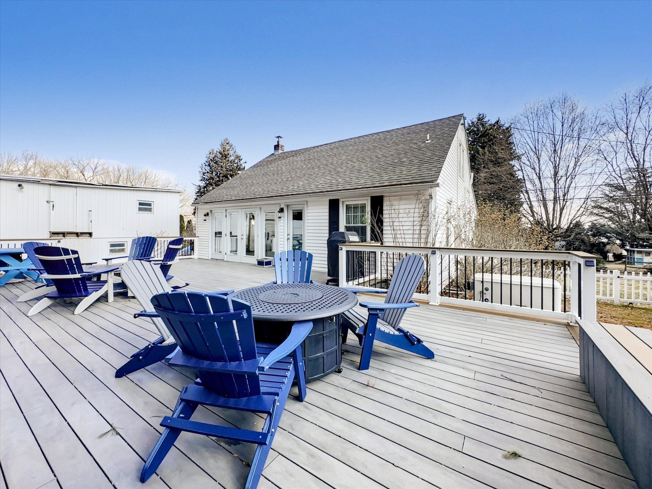 image Expansive deck with outdoor seating, ideal for enjoying fresh air and scenic surroundings.