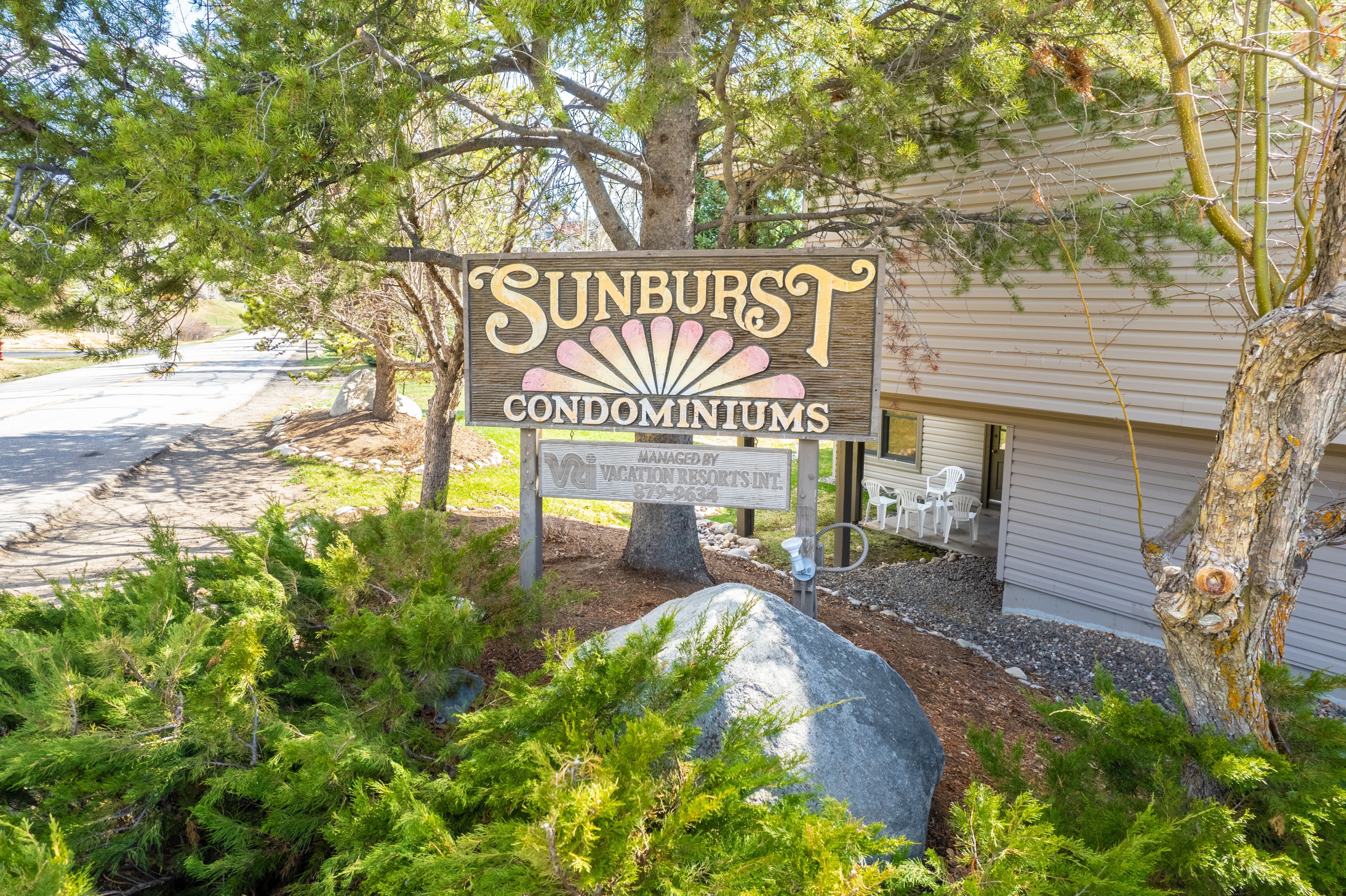 image The welcoming entrance of Sunburst Condominiums, surrounded by lush greenery, invites guests to unwind in the beautiful mountain setting.