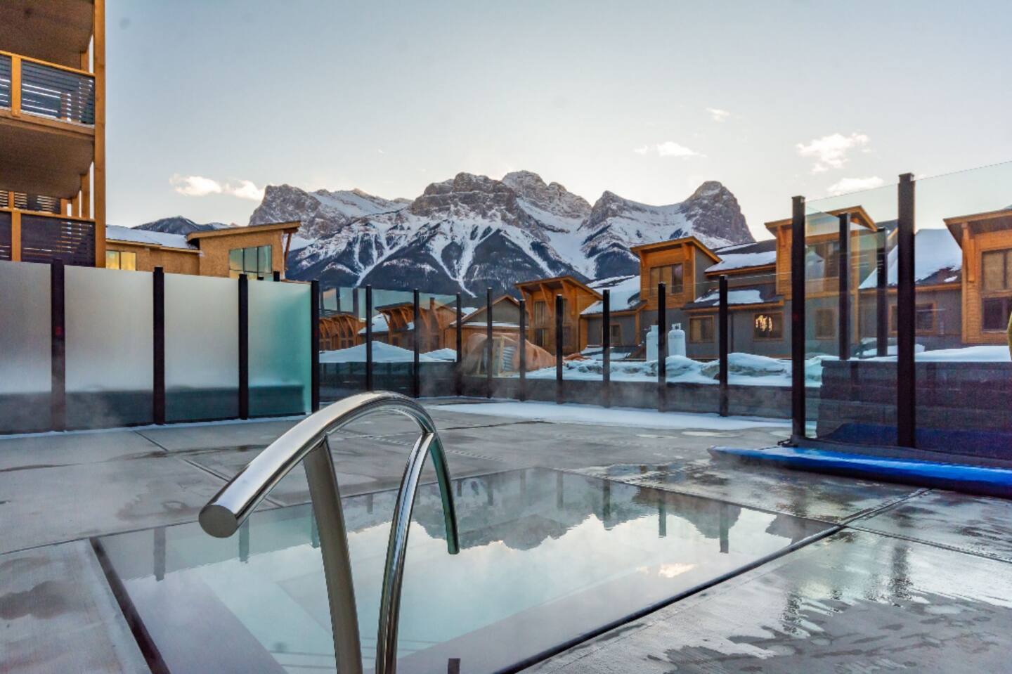image Soak in the outdoor hot tub with sweeping mountain views—just steps away from your condo.