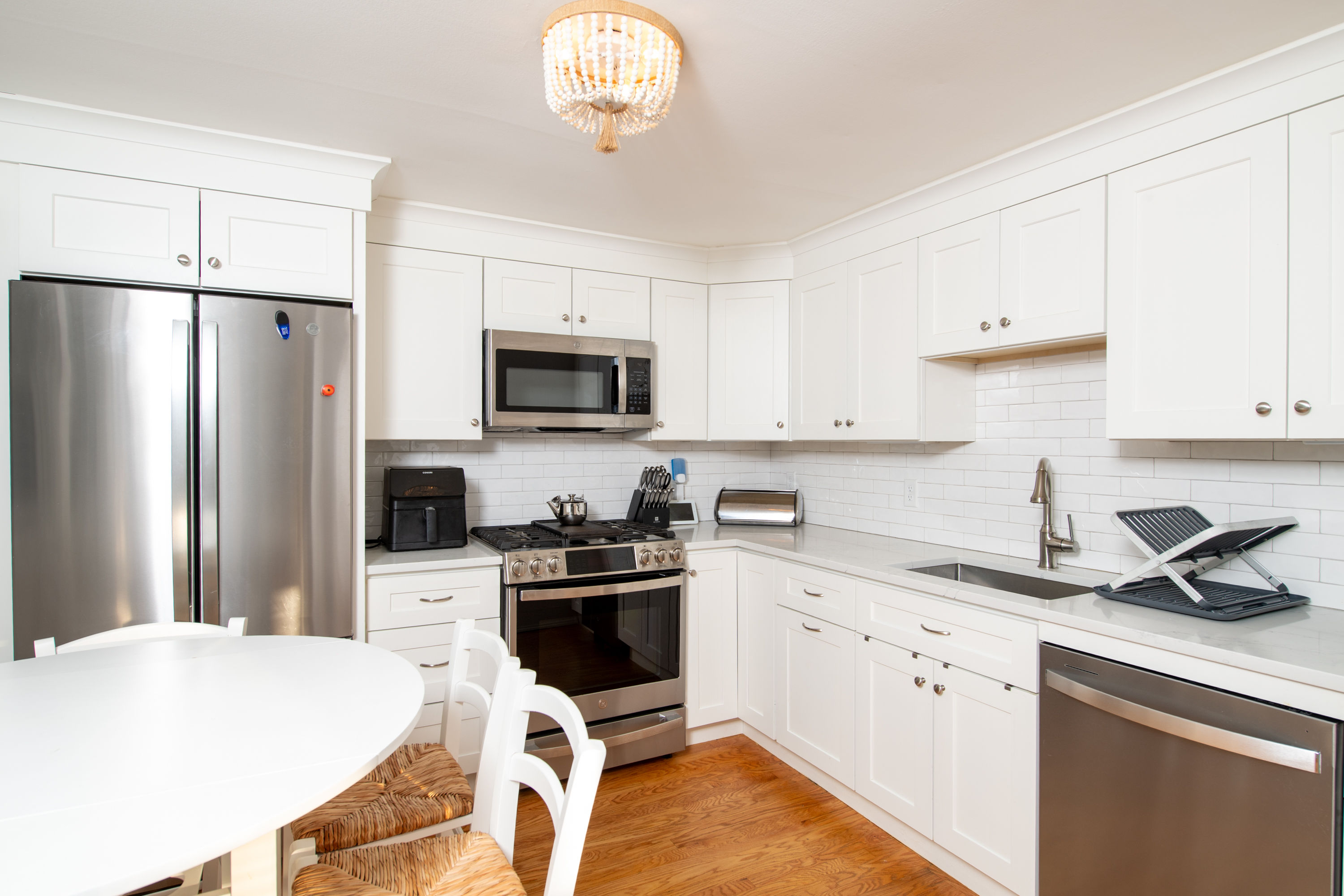 image Modern kitchen featuring stainless steel appliances and everything you need for convenient at-home dining.