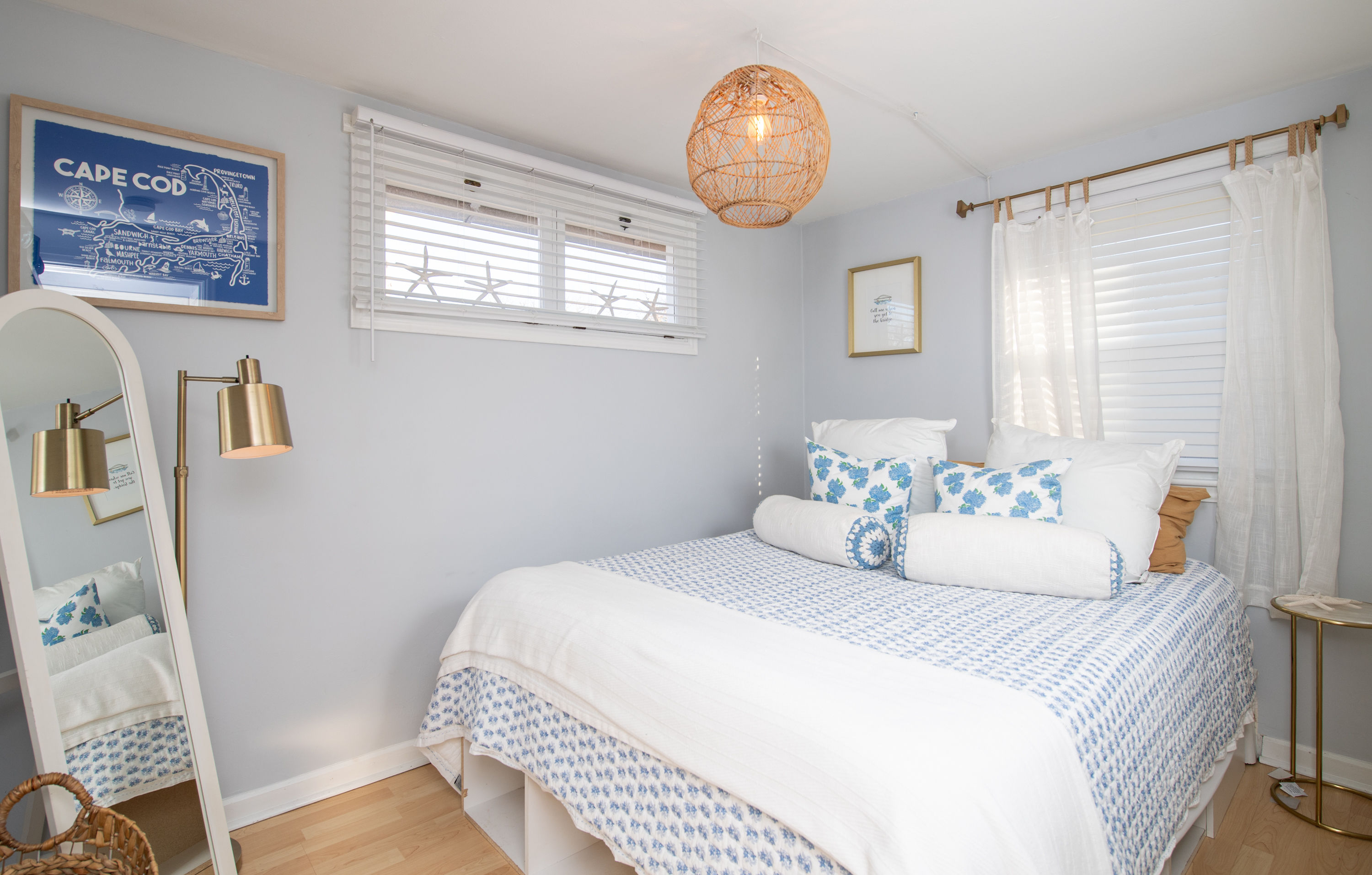 image Charming bedroom with a queen bed, soft coastal hues, and a peaceful setting for restful nights.