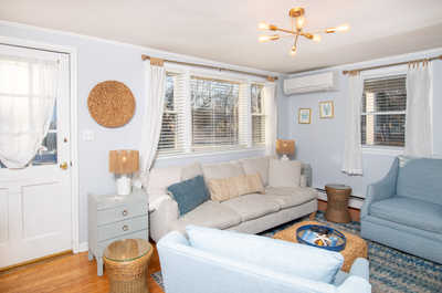Inviting seating area with plush furnishings and soft lighting — a perfect place to unwind with a good book.