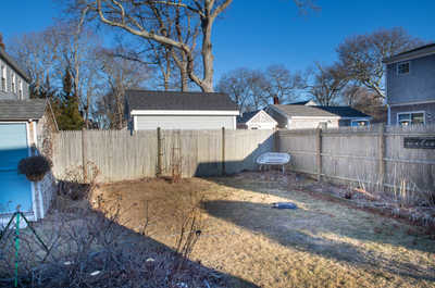 Fenced backyard with plenty of open space and privacy, ideal for outdoor lounging or family time.