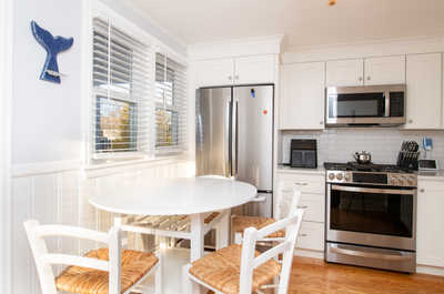 Sunny breakfast area just off the kitchen, creating a warm and welcoming morning routine spot.