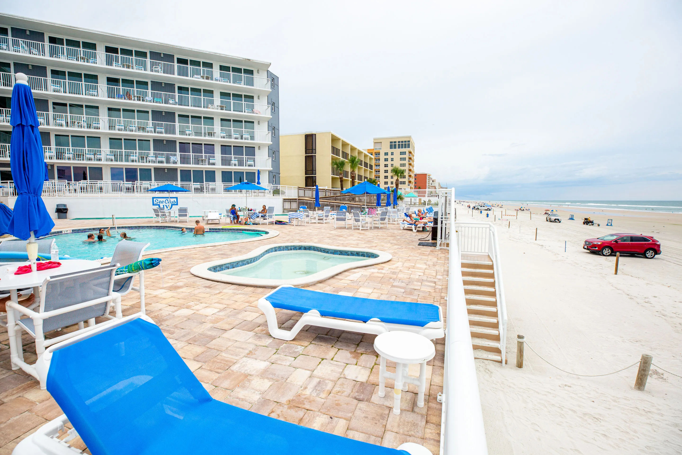 image A picturesque view from the poolside, showcasing the beautiful beach and inviting atmosphere of Sea Club IV Resort.