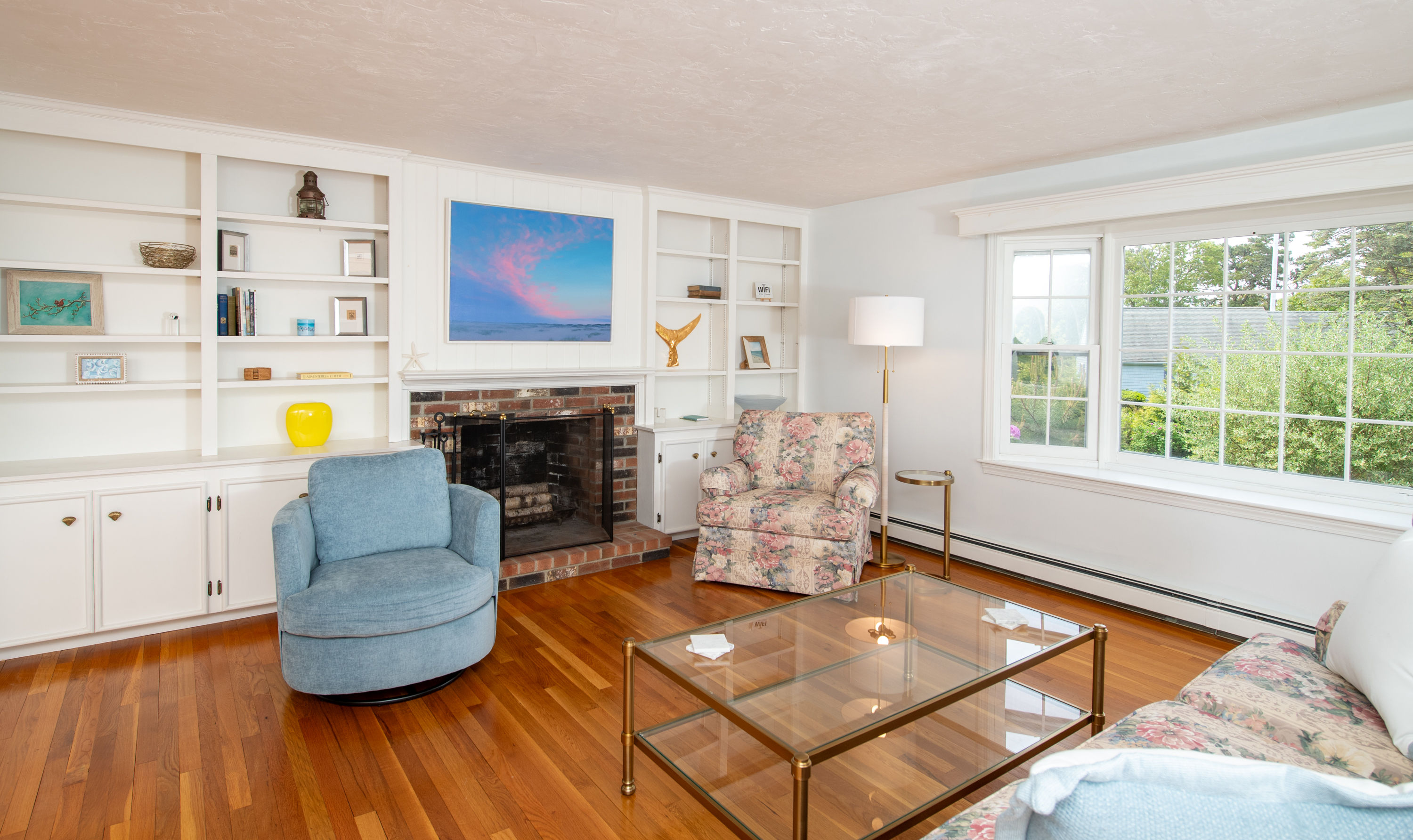 image Bright sitting area with coastal décor—gather here for games, books, or evening chats.